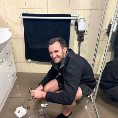 Reactive plumber repairing a leaking toilet in a Sydney bathroom
