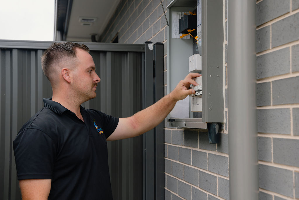 Reactive electrician working on a residential switchboard